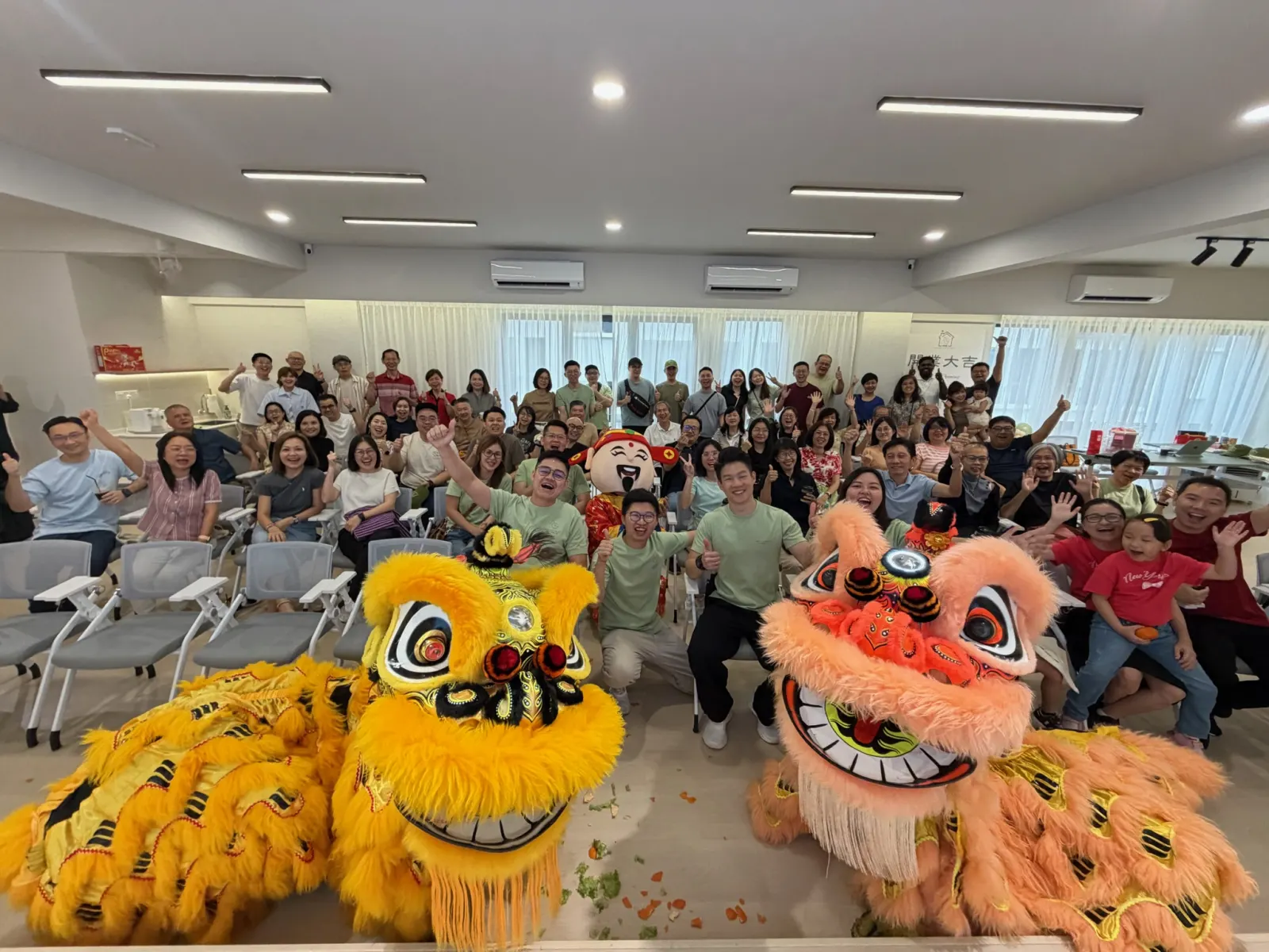 A lion dance performance opening the AG Hub celebration in front of guests