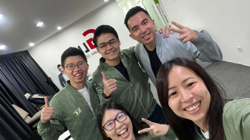 A group of colleagues posing for a photo during a session